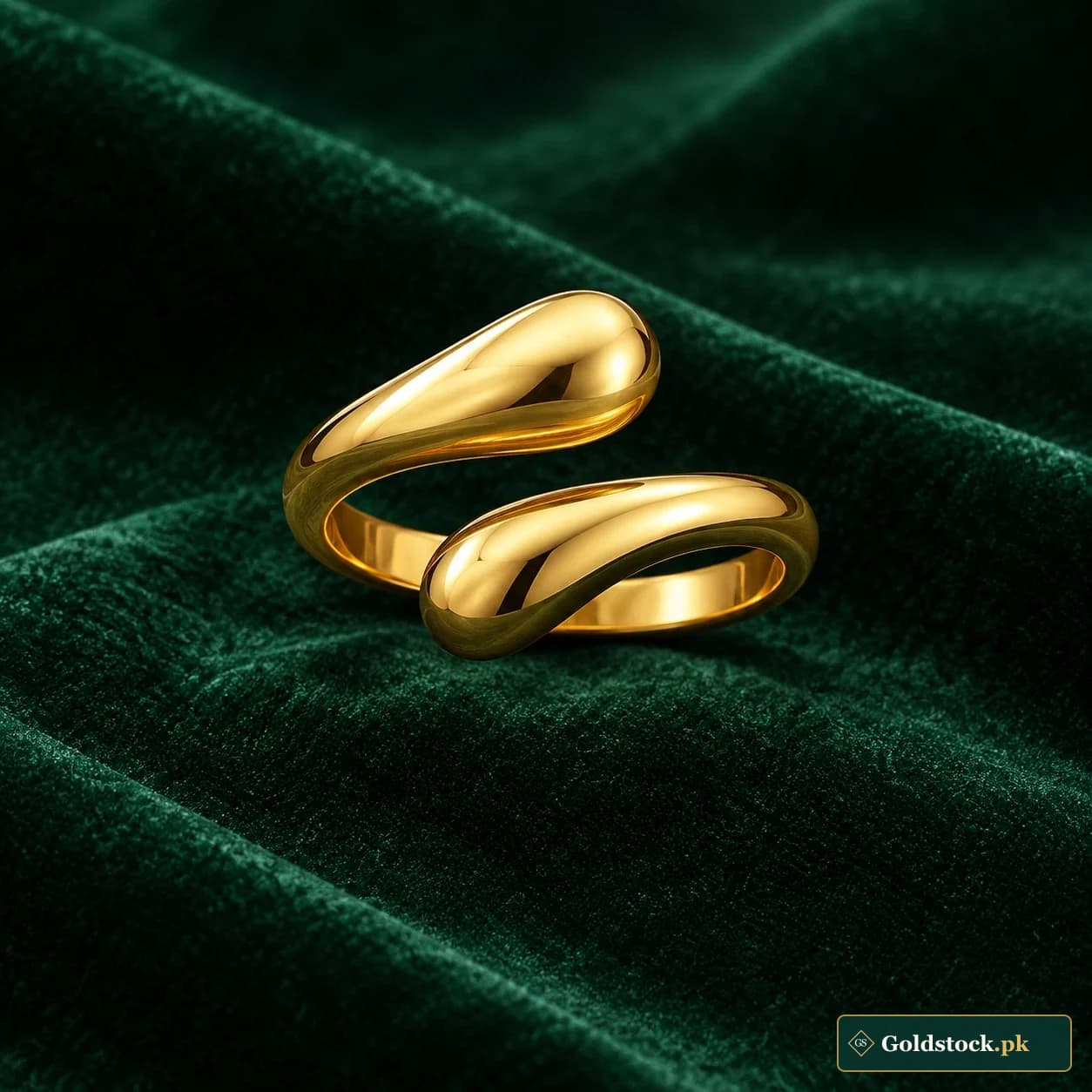 Inaya Spiral Ring: a gold-tone ring formed from a sculptural continuous spiral with polished rounded ends