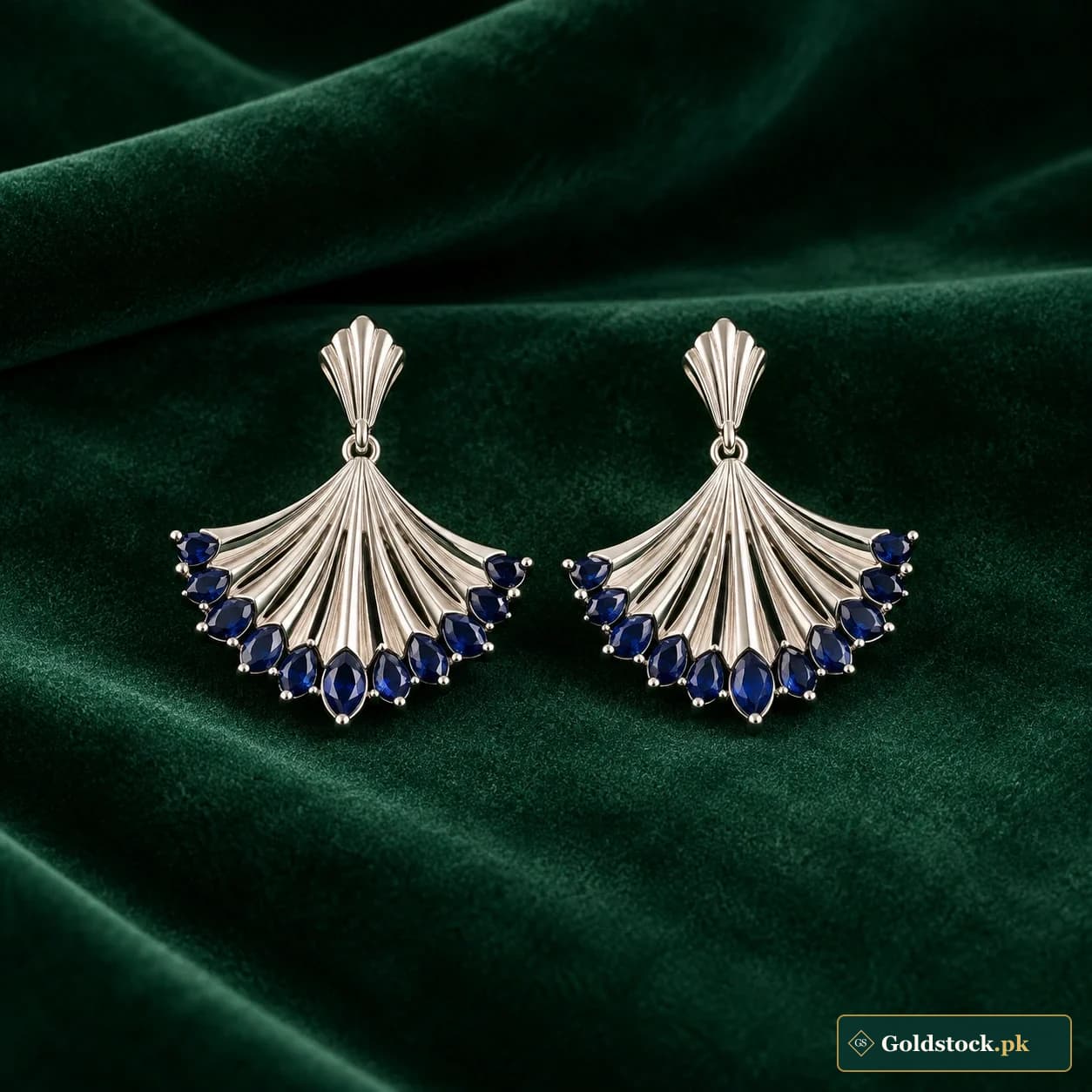 Anaya Blue Fan Earrings: a pair of silver-tone fan-shaped earrings with dark blue decorative accents along the lower edges