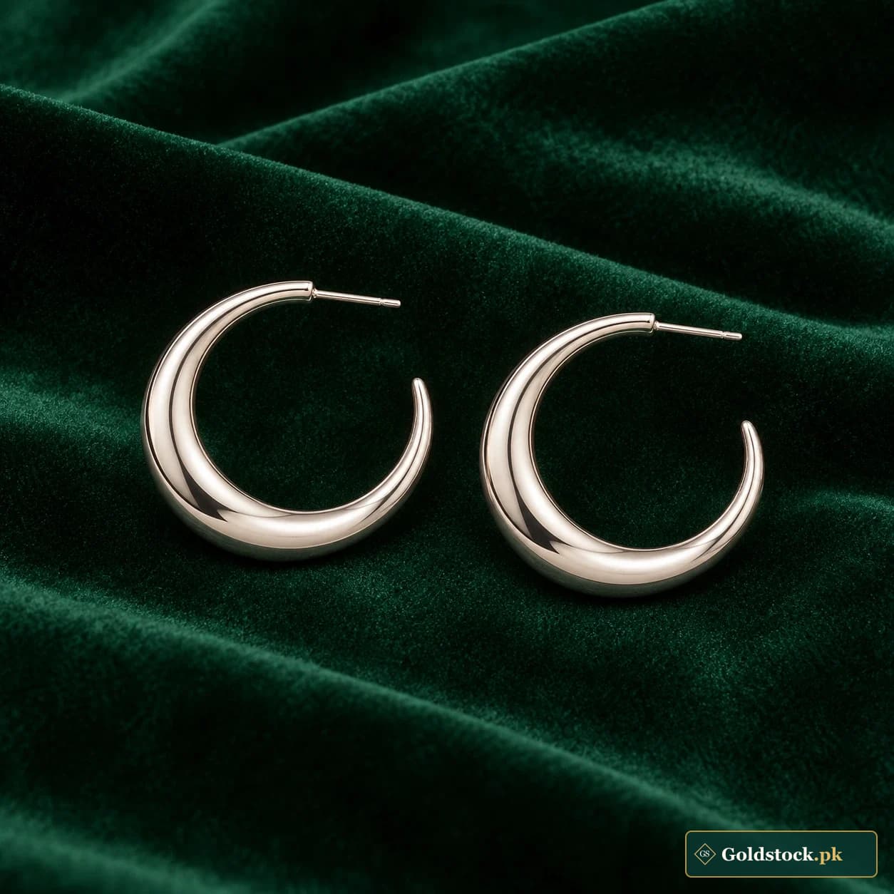 Amna Crescent Hoop Earrings: a pair of silver-tone open crescent hoops with smooth tapered tips