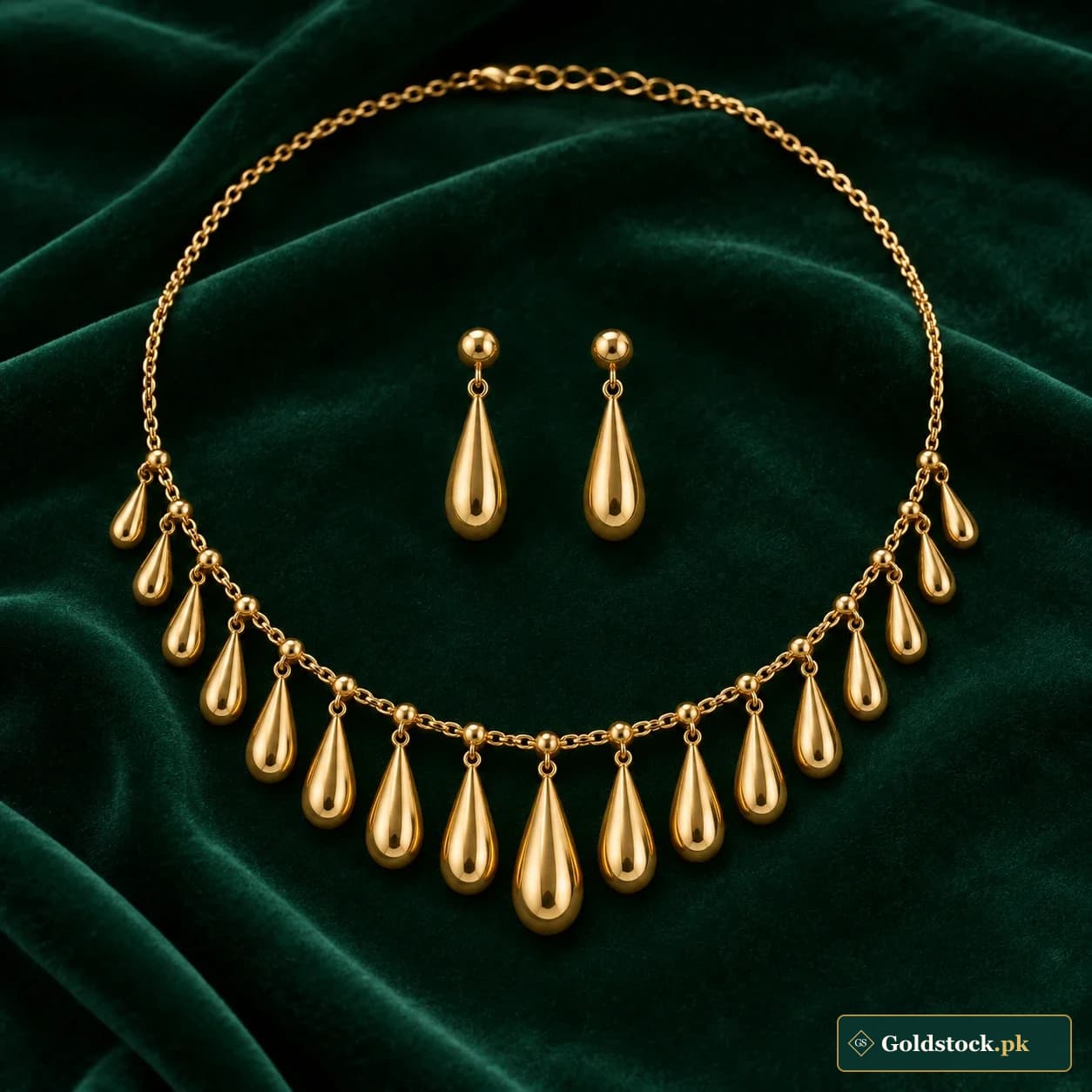 Shabnam Dewdrop Gold Set: a matching gold-tone necklace and earrings with smooth elongated teardrops suspended from a fine linked collar