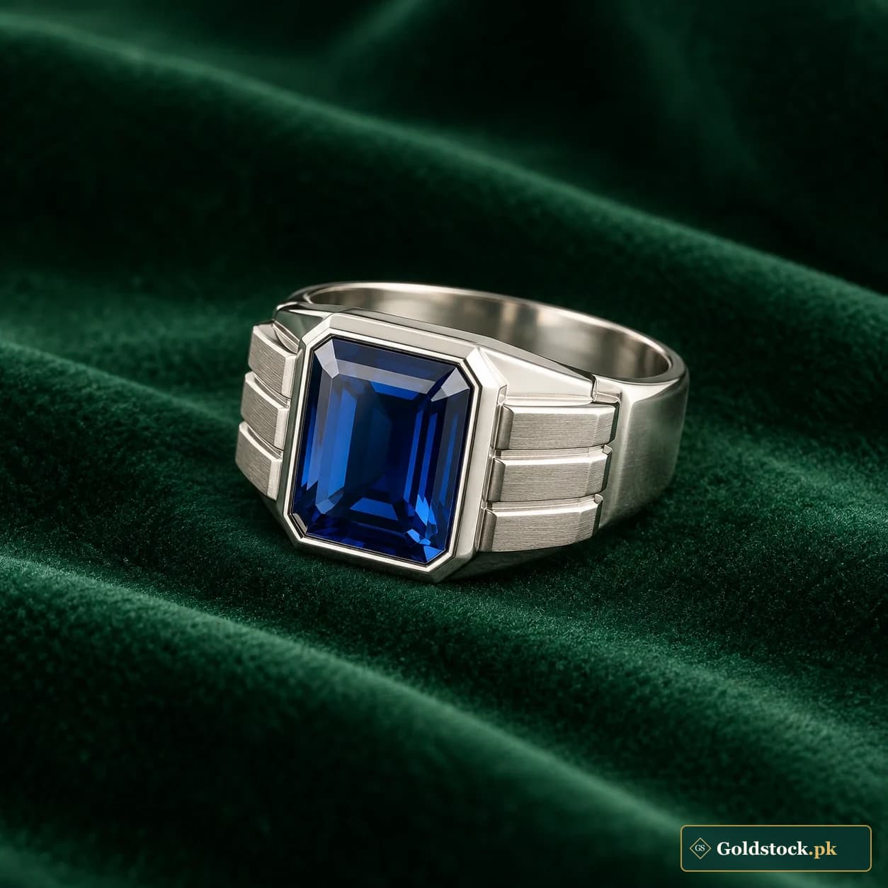 Zehra Blue-Accent Ring: a silver-tone ring with a blue rectangular decorative centre and stepped side details