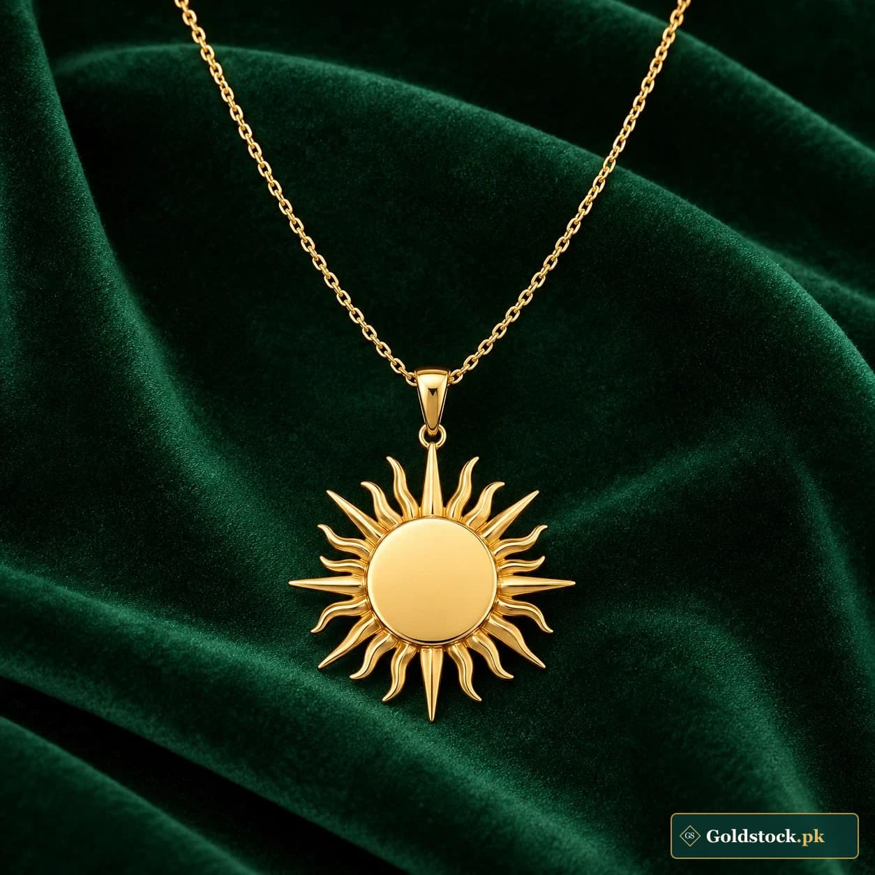 Mirha Sunburst Necklace: a gold-tone necklace with a radiating sunburst pendant and a smooth blank centre