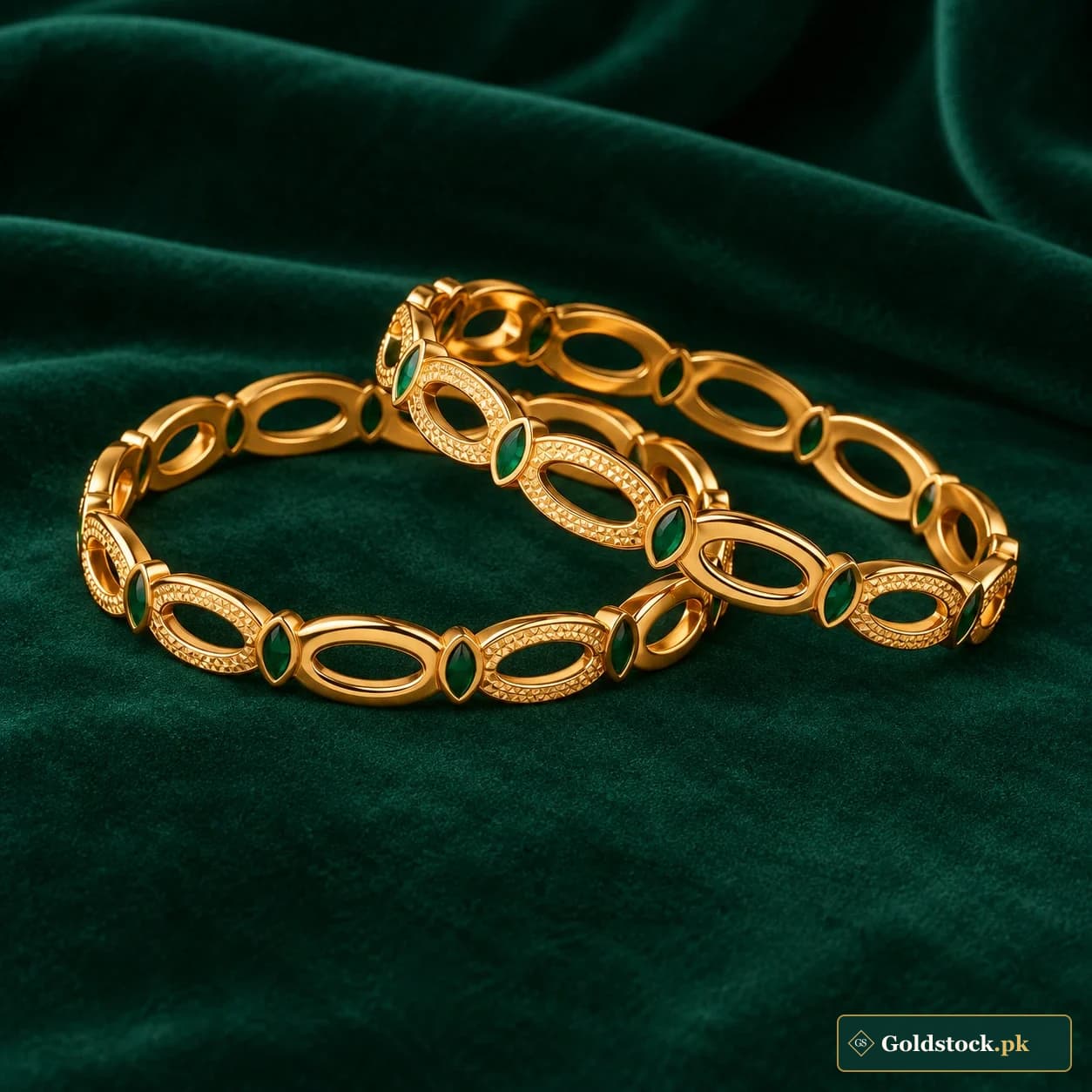 Tabeer Oval-Link Bangles: a pair of rigid gold-tone bangles formed from open elongated oval motifs