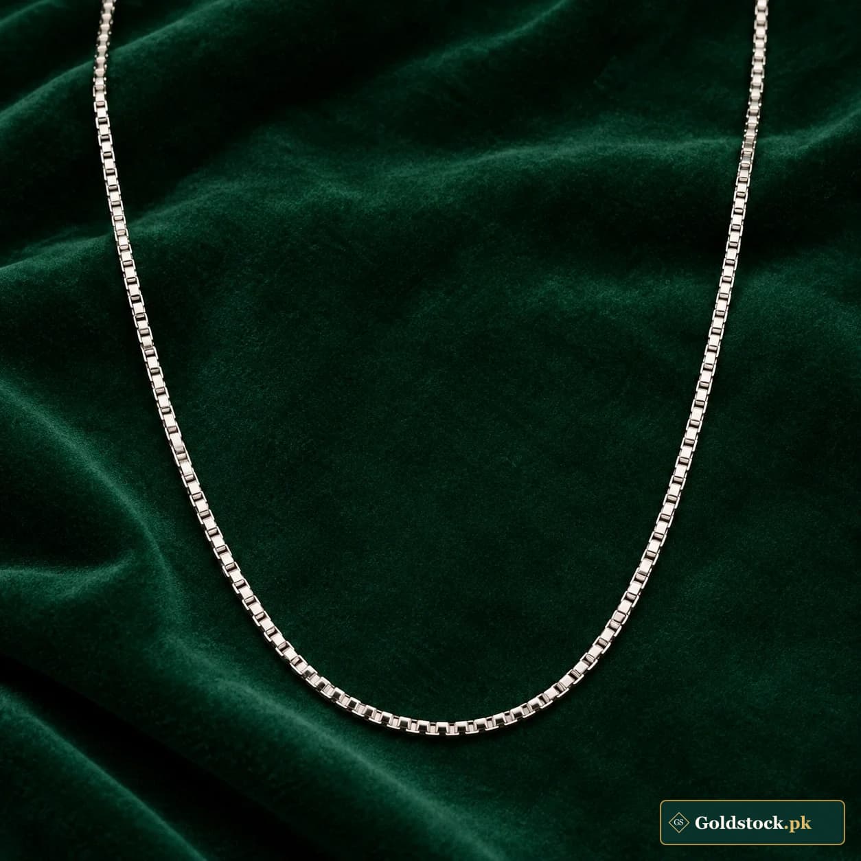 Aftab Box Chain: an unadorned silver-tone neck chain composed of small square box links