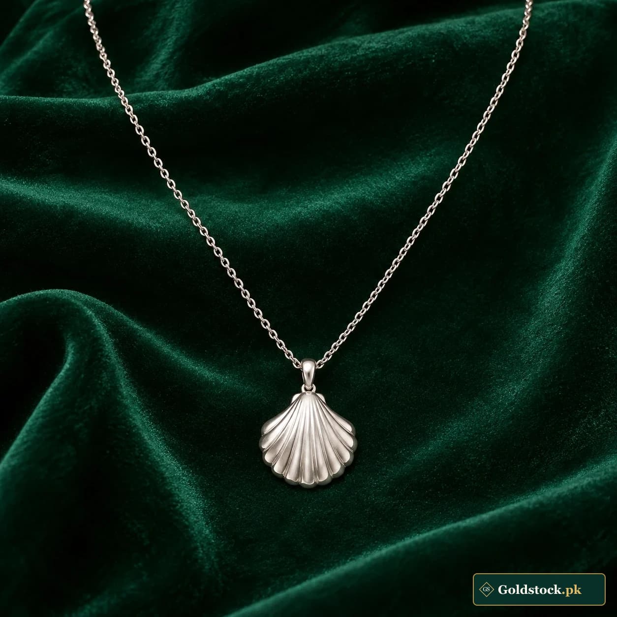 Sadaf Shell Necklace: a silver-tone necklace with a softly fluted shell-shaped pendant