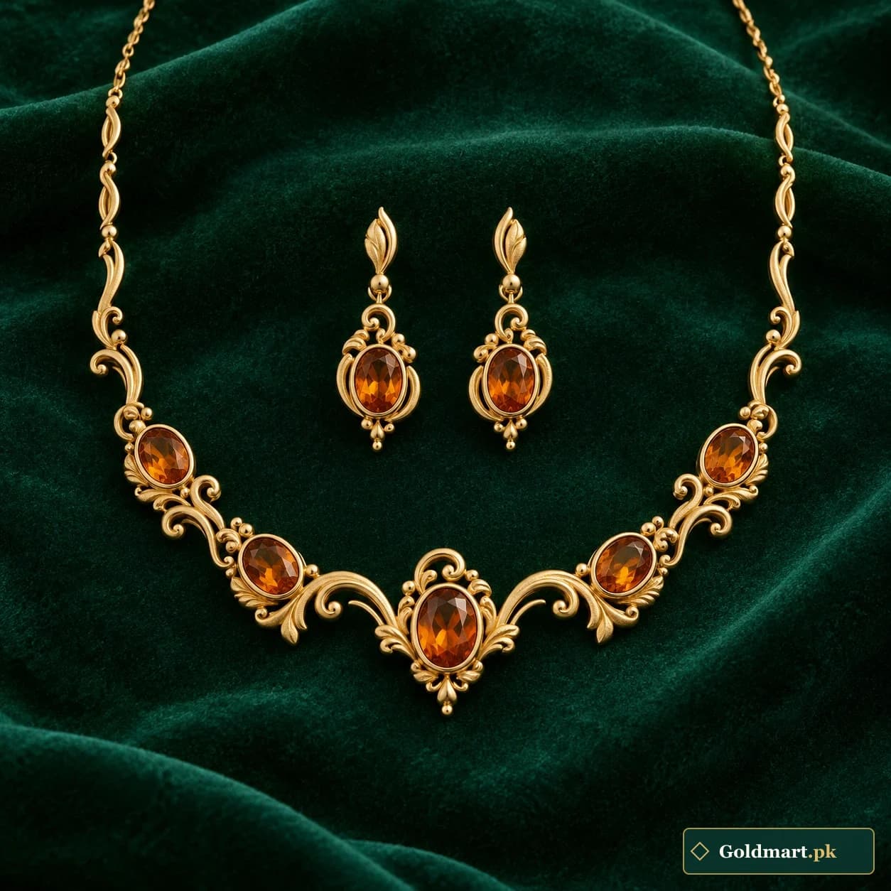 Pariza Amber-Accent Gold Set: a matching gold-tone necklace and earrings with amber-coloured oval accents in delicate scroll surrounds