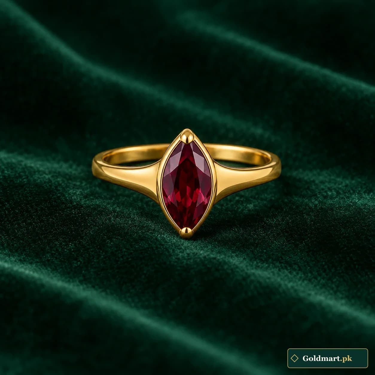 Yara Marquise-Accent Ring: a gold-tone ring with a dark red marquise-shaped decorative centre and plain tapered shoulders