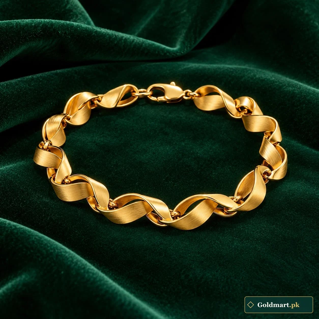Sania Ribbon Bracelet: a gold-tone bracelet with gently folded ribbon-shaped links