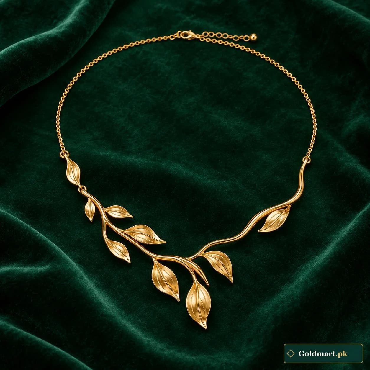 Humaira Branch Necklace: a gold-tone necklace with an asymmetric sculpted branch and polished leaf details