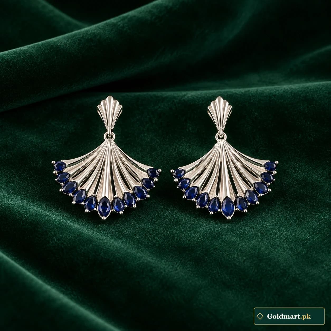 Anaya Blue Fan Earrings: a pair of silver-tone fan-shaped earrings with dark blue decorative accents along the lower edges